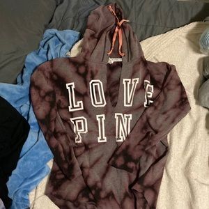 i’m selling a grey sweatshirt/tie died with a v neck, has never been worn.
